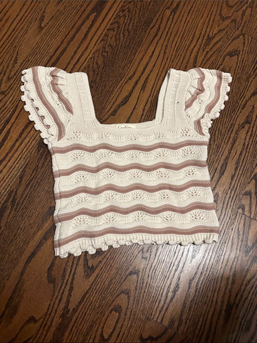 Jessica Simpson cropped knit top with ruffle trim.
